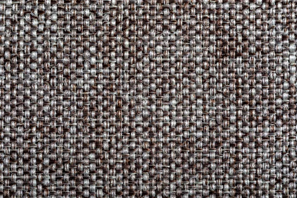 Brown fabric texture. Furniture upholstery textiles. Embossed pattern. Woven fibers. The material is soft touch. Minimalism concept. High detail macro photography for backgrounds or wallpapers. — Stock Photo, Image