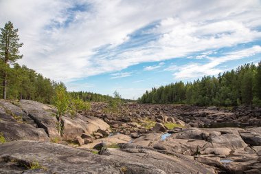 Stone River. Summer landscape of a river with rocks and forest in Belomorsk, Karelia, Russia. Panorama view.