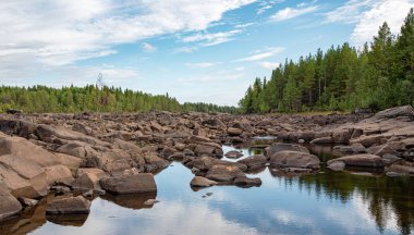 Stone River. Summer landscape of a river with rocks and forest in Belomorsk, Karelia, Russia. Panorama  view.