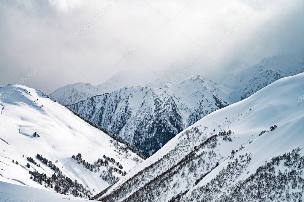 Beautiful landscape winter summer day on snowy mountain in ski resort Arkhyz, Caucasus mountains, Russia. 