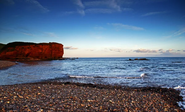 Budliegh stranden i solnedgången — Stockfoto