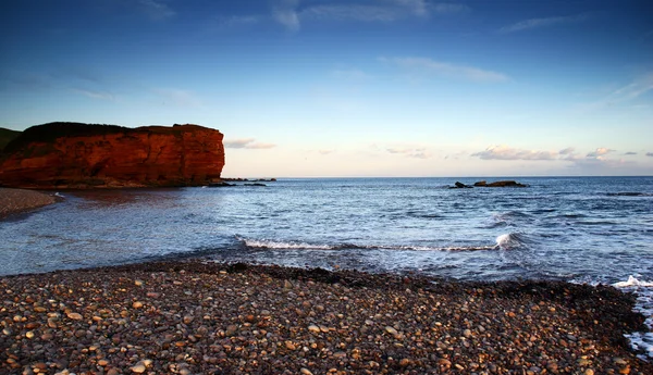 Budliegh stranden i solnedgången — Stockfoto