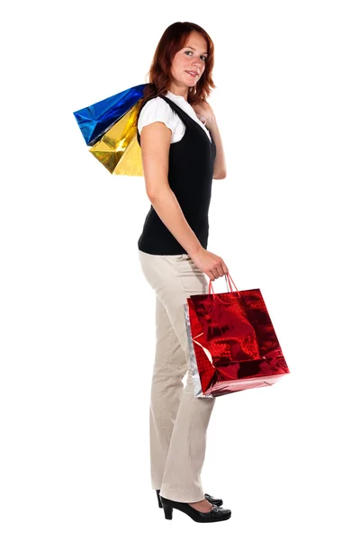 Mujer de compras, bolsos altos. Mirando la cámara — Foto de Stock