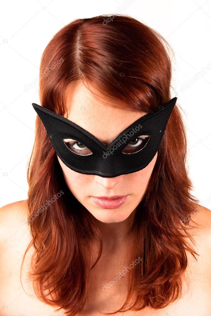 red-headed woman in the mask