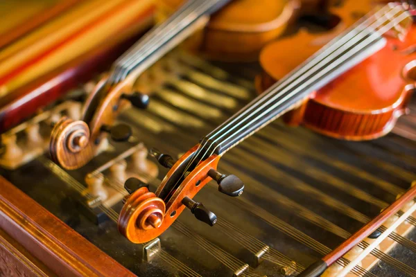 Violin detail with another one and cimbalom behind — Stock Photo, Image