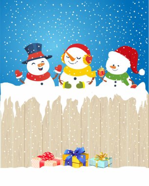 Noel kompozisyonu, çitin arkasında duran kardan adamlar. 