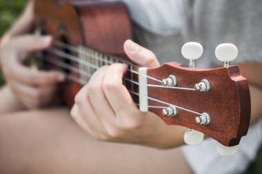 Hand playing guitar clipart