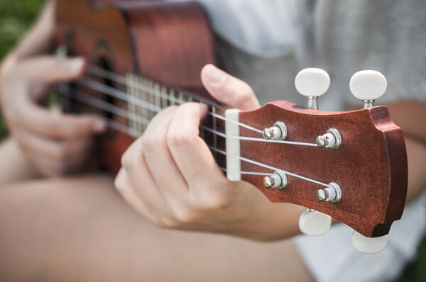 Hand playing guitar