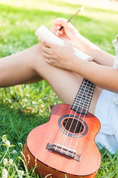 Song writer with little guitar — Stock Photo, Image