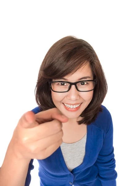 Portrait of young smiling business woman pointing finger at view — Stock Photo, Image