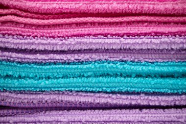 Stack of colorful beach or bathroom towels in closeup