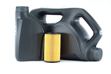 Car oil filter and motor oil can isolated on a white background. Car servicing, automotive industry or oil and filter replacing maintenance