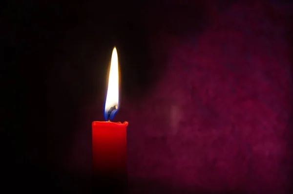 Single Red Candle Burning Alone Dark Red Background Conceptual Image — Fotografia de Stock