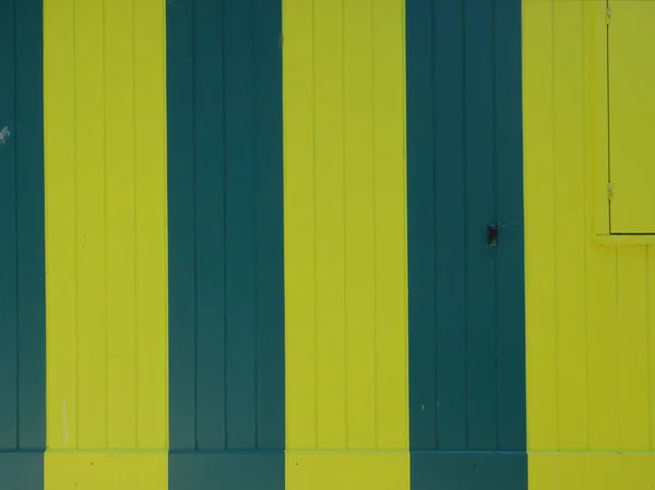 Green Yellow Striped Wooden Cabin Closed Shutter — Zdjęcie stockowe
