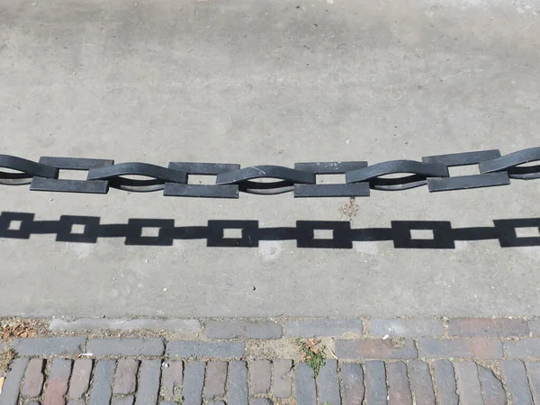 Chain Shadow Forming Partition Sidewalk Road — Stock fotografie