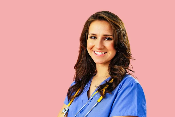 Close Portrait Smiling Female Doctor Nurse Stethoscope Blue Uniform Pink — Stock Photo, Image