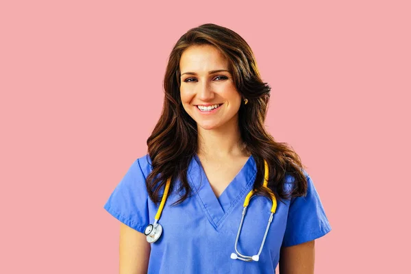 Portrait Smiling Female Doctor Nurse Stethoscope Blue Uniform Pink Studio — Stock Photo, Image