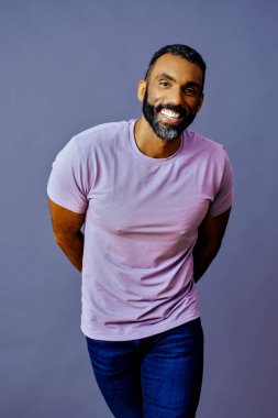 portrait of a handsome african american man with beard and mustache on a gray background