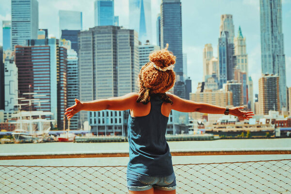 Beautiful young happy woman enjoying the view of the city