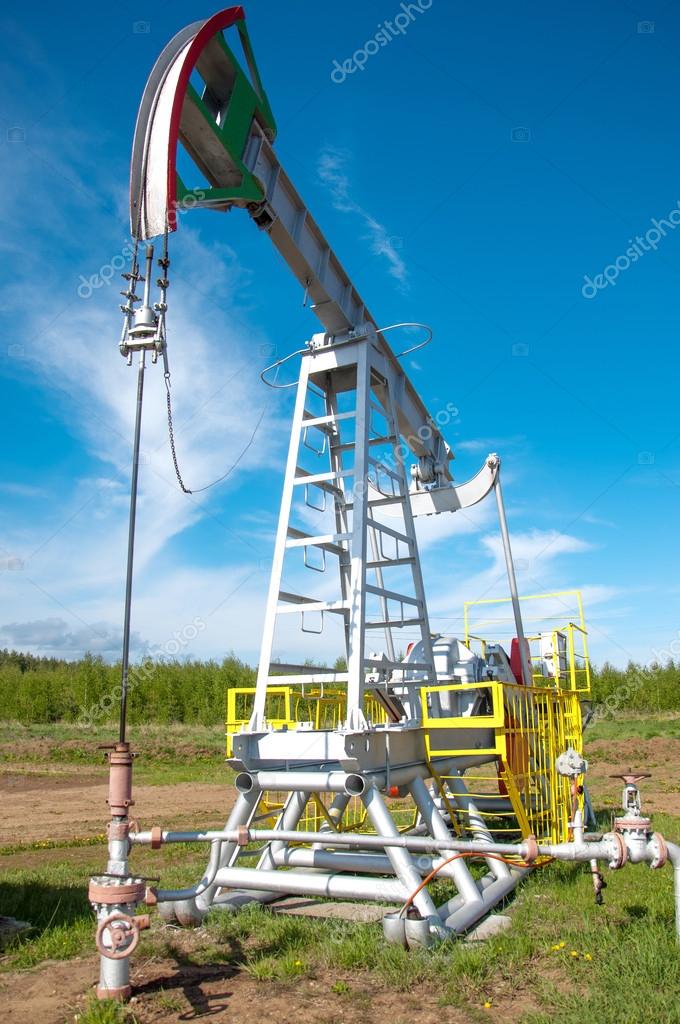 Oil pump jack in operation — Stock Photo © ekina1 25781803