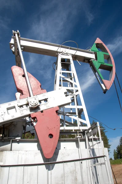 Oil pump jack in operation — Stock Photo, Image