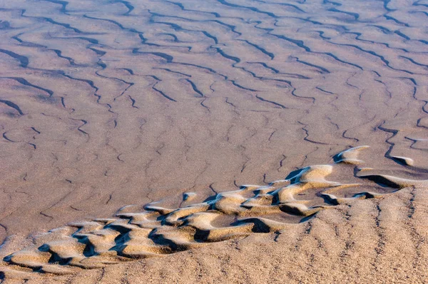 Tekening in het zand op het tij — Stockfoto