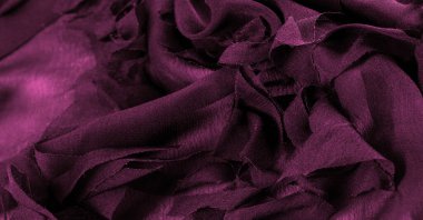 Doku. Arka plan kırmızı bordo ipek kumaş, üst manzara. Kırmızı ipeğin ya da satenin pürüzsüz dokusu, kopyalama alanı olan soyut bir arkaplan olarak kullanılabilir.