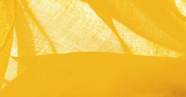 Sarı ince taneli doku. Sarı ipek keçeli kadife kumaş. Doku arka planı. Arkaplan kumaşı