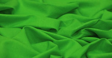 Yeşil keten kumaş. Keten kumaş lüks olarak kabul edilir çünkü keten fabrikasından işlemek zahmetli bir iştir. Güzel, dayanıklı ve ebediyen çekici..