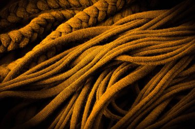 Sarı örgülü kumaş. Kabartmalı desenli örgü bir arka plan. Örgü ören örgüler. Arkaplan deseni.