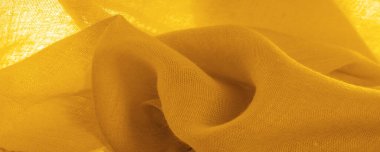 Sarı ince taneli doku. Sarı ipek keçeli kadife kumaş. Doku arka planı. Arkaplan kumaşı