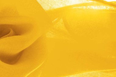 Sarı ince taneli doku. Sarı ipek keçeli kadife kumaş. Doku arka planı. Arkaplan kumaşı