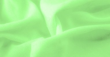 Yeşil kumaş. Lüks kumaşın soyut arka planı ya da dalgaların sıvı ipek dokusu ya da dalgalı kıvrımlar. arka plan ya da zarif duvar kağıdı tasarımı. Pamuk dokusu, doğal kumaş ve boya.