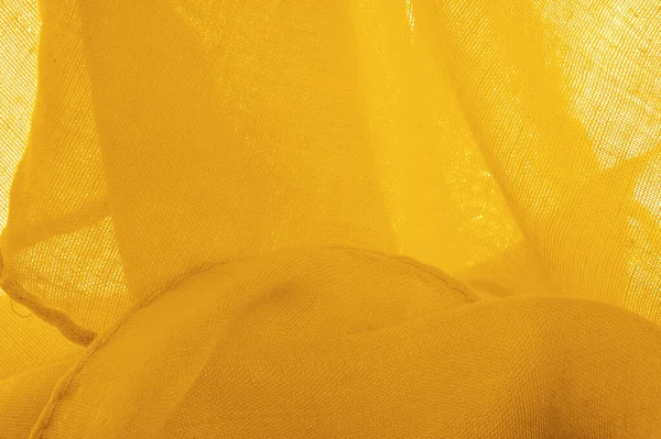 Sarı ince taneli doku. Sarı ipek keçeli kadife kumaş. Doku arka planı. Arkaplan kumaşı