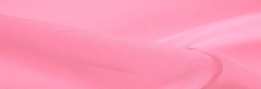 İpek kırmızı polyester. Pembe ipek kumaşın arka planı. Şeffaf arkaplan ve elbise dikmek için açık kumaştan yapılmış. Tekstil panoraması. Dokuma. şablon.
