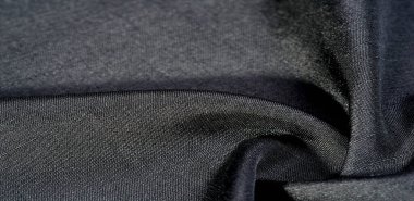 Siyah kumaş. Doğal kumaştan soyut kırmızı arkaplan. Pamuk. Doku, arkaplan, desen