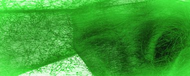 Yeşil ipek kumaş, kumaşta dokuma iplik, kabarık efekt. Arkaplan dokusu, dekoratif süs