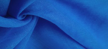 Lacivert ipek kumaş, mavi ince tahıl kumaşı. Masaüstü ürünü, görüntü perspektifi, stüdyo fotoğrafçılığı. ürün demo afişi.