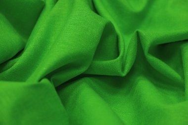 Yeşil keten kumaş. Keten kumaş lüks olarak kabul edilir çünkü keten fabrikasından işlemek zahmetli bir iştir. Güzel, dayanıklı ve ebediyen çekici..