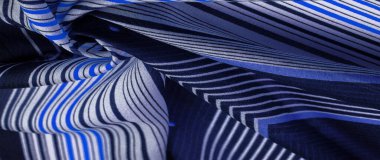 İpek kumaş, mavi arka plan, çizgili beyaz ve mor çizgiler, Meksika teması, Meksika pançosu kostümleri. Desen deseni, koleksiyon,