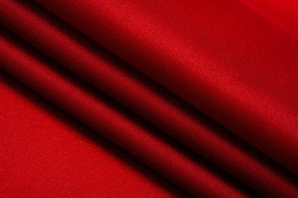 red silk fabric, this is silk satin weaving. Differs in density, smoothness and gloss of the front side, softness, Texture, background