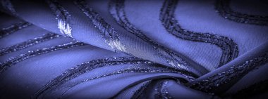 Mavi çizgili ipek kumaş. Safir tonlarında soyut ipek renkler. Kumaşta eski model. Arkaplan dokusu, dekoratif süs