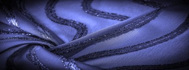 Mavi çizgili ipek kumaş. Safir tonlarında soyut ipek renkler. Kumaşta eski model. Arkaplan dokusu, dekoratif süs