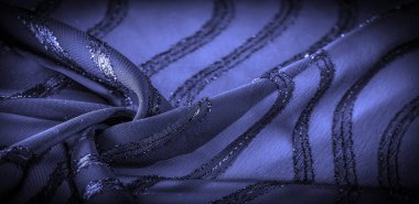 Mavi çizgili ipek kumaş. Safir tonlarında soyut ipek renkler. Kumaşta eski model. Arkaplan dokusu, dekoratif süs