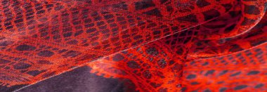 Tekstil malzemesinden kırmızı arka plan. dantel kumaş. Doğal yakut dokusu. Doku, arkaplan, desen.
