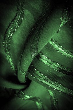 Yeşil çizgili ipek kumaş. Zümrüt tonlarında soyut ipek tonlar. Kumaşta eski model. Arkaplan dokusu, dekoratif süs