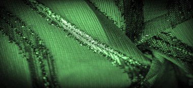 Yeşil çizgili ipek kumaş. Zümrüt tonlarında soyut ipek tonlar. Kumaşta eski model. Arkaplan dokusu, dekoratif süs