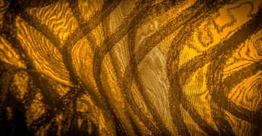 Koyu çizgili kahverengi ipek kumaş. Altın tonlarında soyut ipek tonlar. Kumaşta eski model. Arkaplan dokusu, dekoratif süs