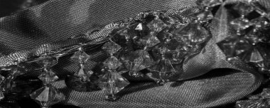 Siyah ipek kumaş, siyah cam boncuklarla süslenmiş, boncuklarla süslenmiş, tasarım kartı, arkaplan dokusu