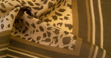 Kahverengi ve beyaz çizgili ipek kumaş, Afrika tarzı zebra derisi. Çizgili arka plan dokusu tekrarlanıyor. Tasarımcı için, tasarımın taslağı, dekoratörün çevresi.. 